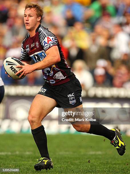 Daly Cherry-Evans of the Sea Eagles runs the ball during the round 22 NRL match between the Manly Warringah Sea Eagles and the Sydney Roosters at...