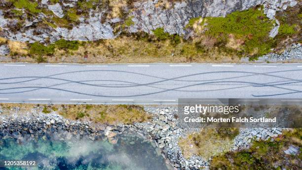skid marks on a concrete road - condado de hordaland fotografías e imágenes de stock