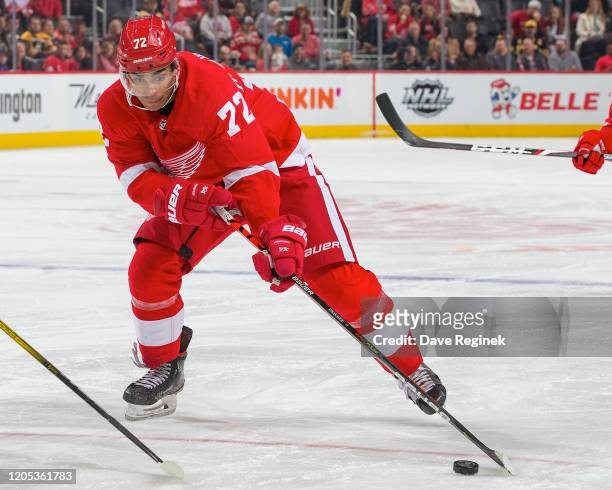 Andreas Athanasiou of the Detroit Red Wings controls the puck against the Boston Bruins during an NHL game at Little Caesars Arena on February 9,...