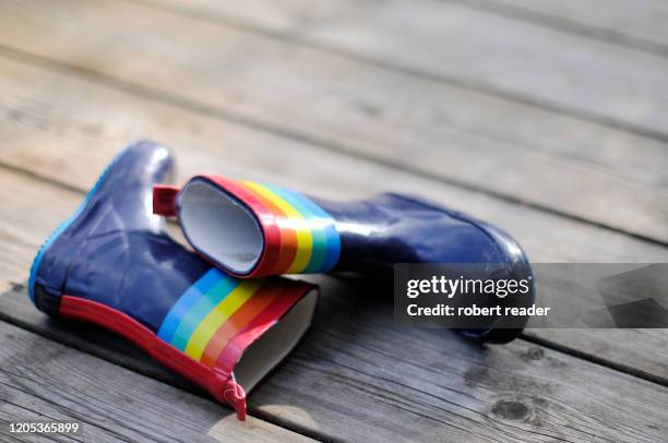 child’s wellington boots - botas de agua fotografías e imágenes de stock