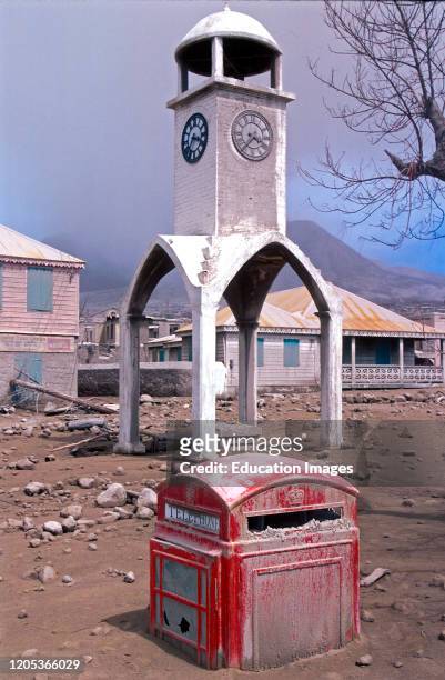 Clock tower red telephone box swamped by volcanic ash Montserrat Soufriere Hills volcano eruptions starting in 1995 destroyed Plymouth capital of...
