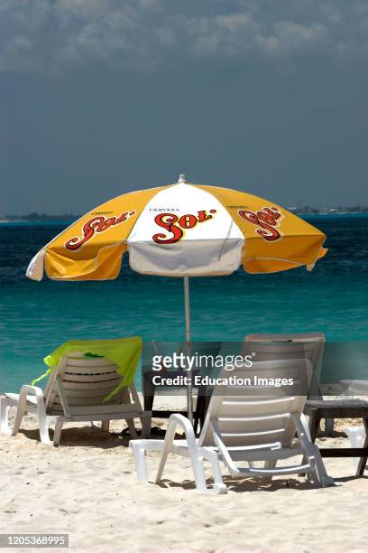 Sun beds and umbrella Playa Sol Isla Mujeres Mexico.