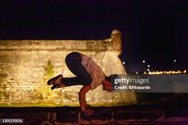 yoga pose at the castillo de san marcos in st augustine - national teacher stock pictures, royalty-free photos & images