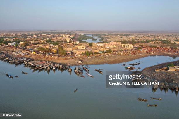 An aerial view shows the harbor of Mopti in central Mali on February 29, 2020. - Two months earlier 400 Dogon people fled their village of Toou...