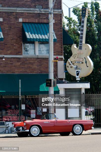 Red Ford Thunderbird and Sun Studio with Gibson guitar motif Memphis Tennessee USA.