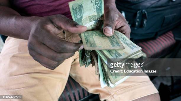 Man counting local Ethiopian currency birr notes.