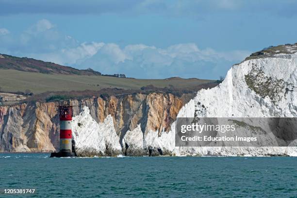 The Needles, Isle of Wight, England, UK, The Needles lighthouse with helipad situated on the outermost chalk rocks. With a backdrop of the multi...