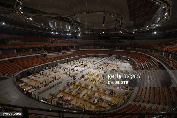 This photo taken on March 5, 2020 shows a temporary hospital set up for COVID-19 coronavirus patients in a sports stadium in Wuhan, in China's...
