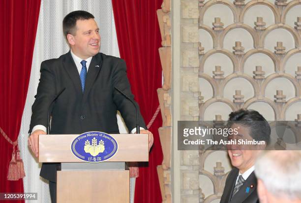 Estonian Prime Minister Juri Ratas addresses while Japanese Prime Minister Shinzo Abe listens during their dinner at the prime minister's official...