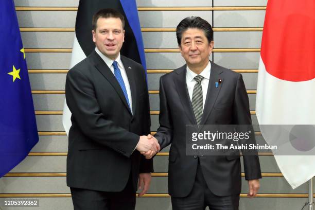 Estonian Prime Minister Juri Ratas and Japanese Prime Minister Shinzo Abe shake hands prior to their meeting at the prime minister's official...
