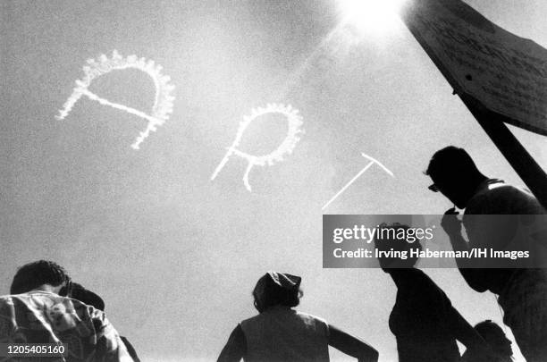 General view of sky writing with the word "ART" scene at the beach circa 1940's in East Hampton, New York.