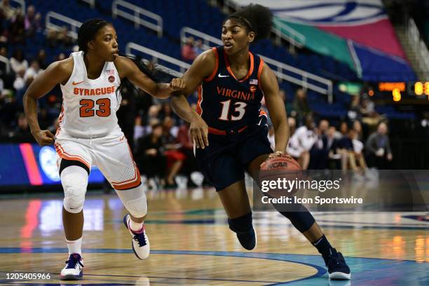 Virginia Cavaliers guard Jocelyn Willoughby drives around Syracuse Orange guard Kiara Lewis during the ACC Women's Tournament game between the...