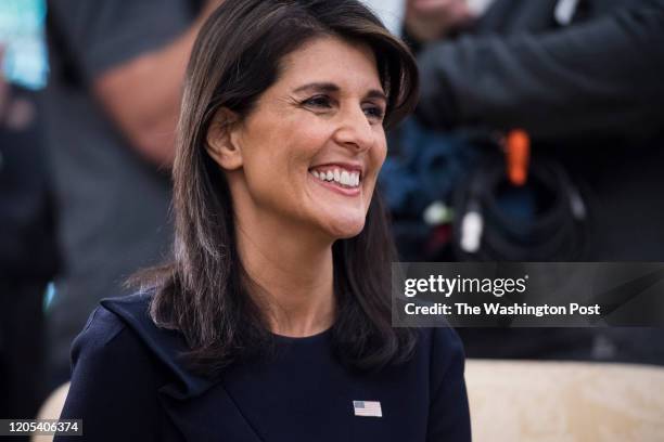 Ambassador to the United Nations Nikki Haley listens as President Donald Trump speaks during a meeting with UN Secretary General Antonio Guterres in...