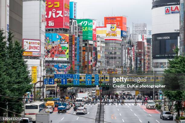shinjuku station busy transportation - crossing stock pictures, royalty-free photos & images