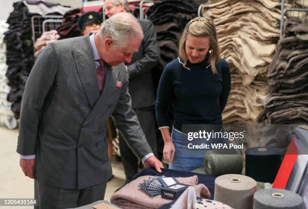 Prince Charles, Prince of Wales, as the patron of the Campaign for Wool, is shown products during a visit to Celtic Sheepskin & Co to mark the firm's...