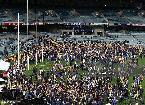 Musician Ross Wilson performs on the field after the round 20 AFL match between the West Coast Eagles and the Richmond Tigers at Patersons Stadium on...