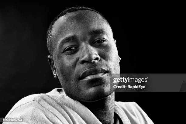 portrait of serious african or african-american man - man passion stock pictures, royalty-free photos & images