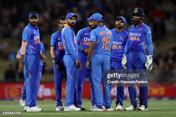 Virat Kohli of India celebrates the wicket of Kane Williamson of the Black Caps with his team during game three of the One Day International Series...