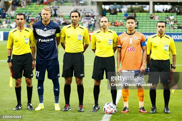 Ola Toivonen of the Victory and Phitiwat Sookjitthammakul of Chiangrai United pose with referees prior to the AFC Champions League Group E match...