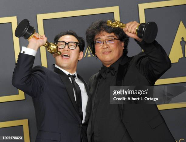 Jin Won Han and Bong Joon Ho pose with Their Awards for Original Screenplay inside The Press Room of the 92nd Annual Academy Awards held at Hollywood...