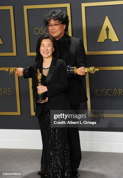 Bong Joon Ho and Kwak Sin-ae pose with his Award for Best Picture and Best International Feature inside The Press Room of the 92nd Annual Academy...