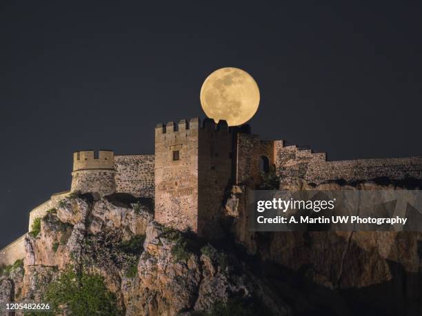 snow moon over the castle - salobreña stock pictures, royalty-free photos & images