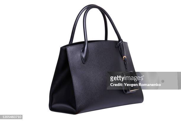 black leather women's handbag on white background - handtasche stock-fotos und bilder