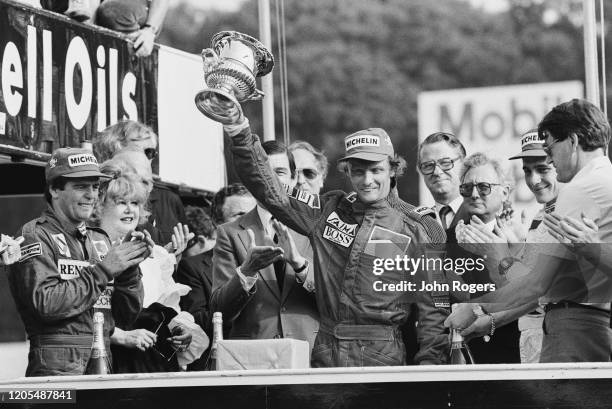 Austrian Formula One driver Niki Lauda of Team Marlboro McLaren International celebrating his victory at the 1984 British Grand Prix at Brands Hatch...