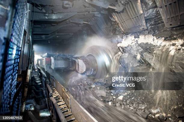 Coal miner operates a coal-cutting machine in a tunnel at a coal mine operated by Beijing Haohua Energy Resource Co., Ltd on September 17, 2019 in...