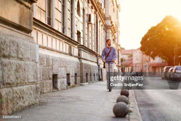 businessman on the wheels - mobility scooter stock pictures, royalty-free photos & images