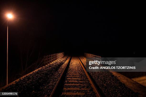 This picture taken from the Greek side of the Greece-Turkey border, shows the railway lines near Kastanies, on March 6, 2020. Greece is attempting to...