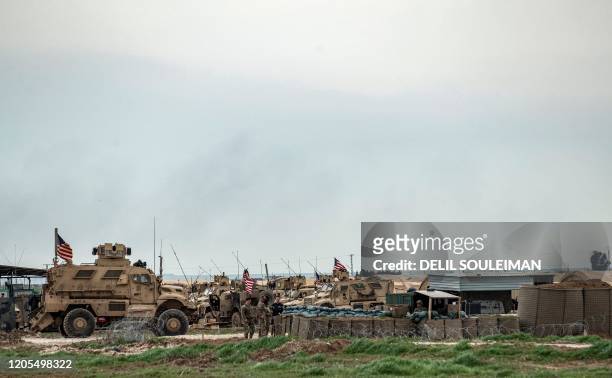 This picture taken on March 6, 2020 shows a view of US soldiers and military vehicles at a military base used by forces that are part of the...
