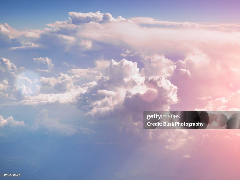 Pastel colored clouds, view of the sky from aircraft