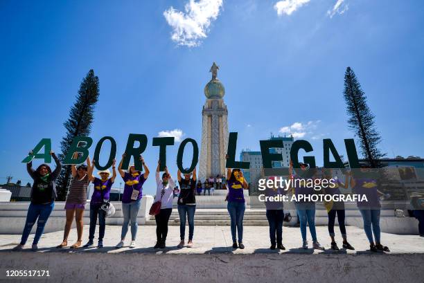 Pro-Choice women hold up letters that spell "aborto legal" during a feminist demonstration on the eve of International Women's Day on March 6, 2020...