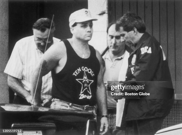 Agents arrest alleged members of Whitey Bulger's Winter Hill Gang on Aug. 10, 1990 in South Boston. The Drug Enforcement Administration indicted 51...