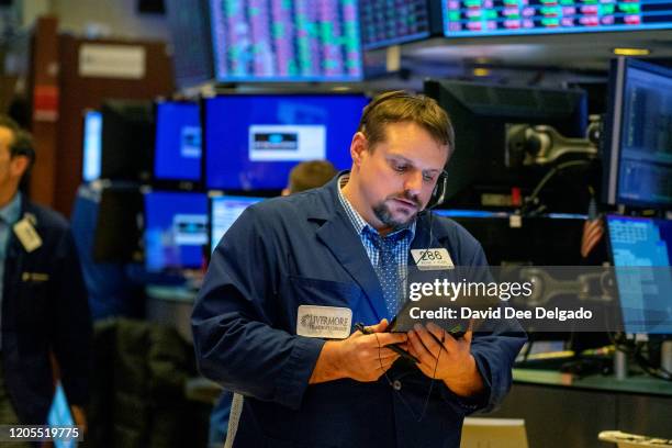 Traders work the floor of the New York Stock Exchange on March 6, 2020 in New York City. Stocks fell for a second day as investors seek refuge in...