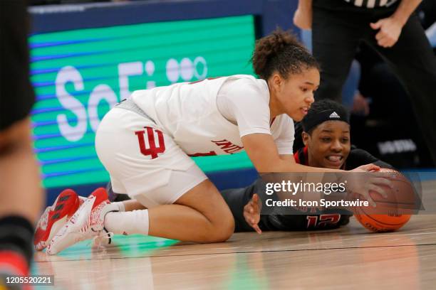 Indiana Hoosiers guard Jaelynn Penn dives for the loose ball with Rutgers Scarlet Knights guard Khadaizha Sanders during the womens Big 10 Tournament...