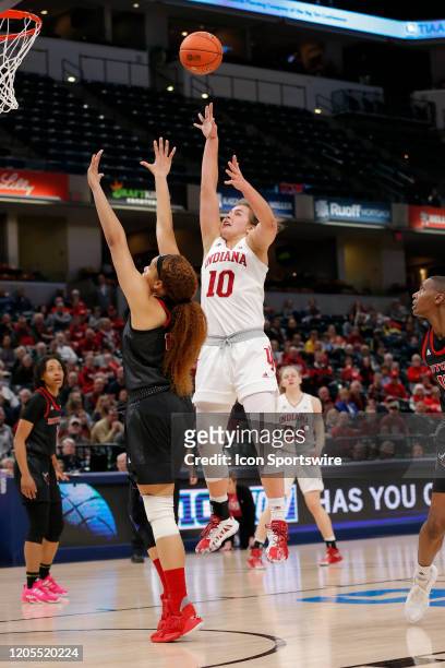 Indiana Hoosiers forward Aleksa Gulbe fires up the jump shot over Rutgers Scarlet Knights center Jordan Wallace during the womens Big 10 Tournament...