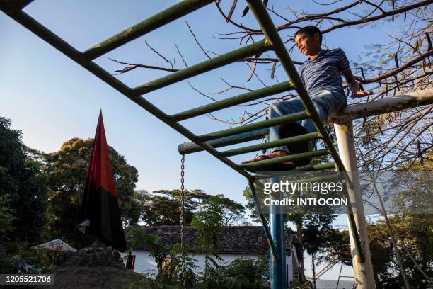 Boy plays at Community "Priest Ernesto Cardenal" in Solentiname, Rio San Juan on March 6, 2020. - Cardenal, figure of the Sandinista revolution and...