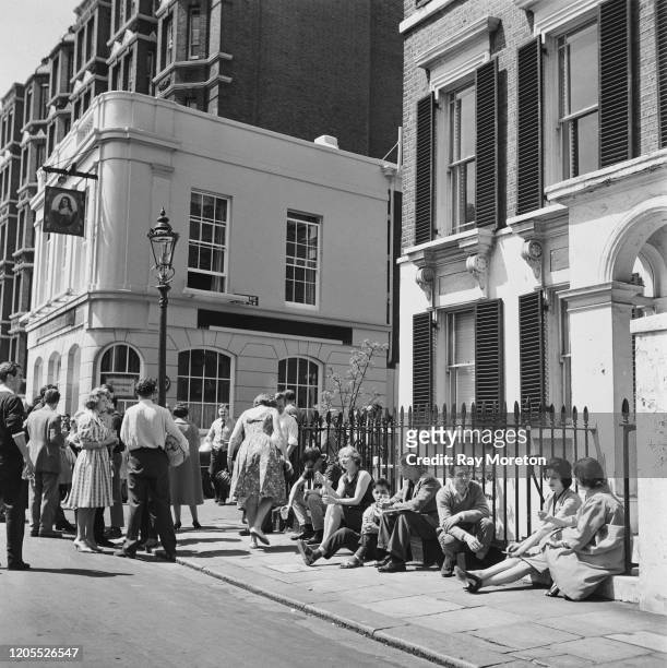 Customers spill out onto the pavement on a busy Sunday morning at the The King's Head and Eight Bells pub on Cheyne Walk, Chelsea, London, September...