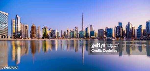 panoramic view of the downtown dubai city skyline and business park at sunset, united arab emirates - dubai skyline stock pictures, royalty-free photos & images