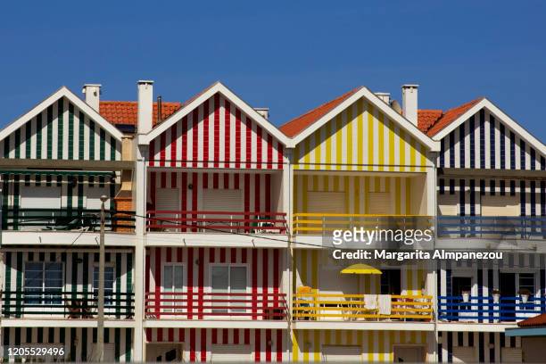 colorfully painted striped houses in costa nova - aveiro stockfoto's en -beelden