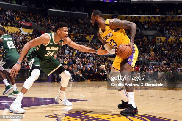 LeBron James of the Los Angeles Lakers handles the ball while Giannis Antetokounmpo of the Milwaukee Bucks plays defense during the game on March 6,...