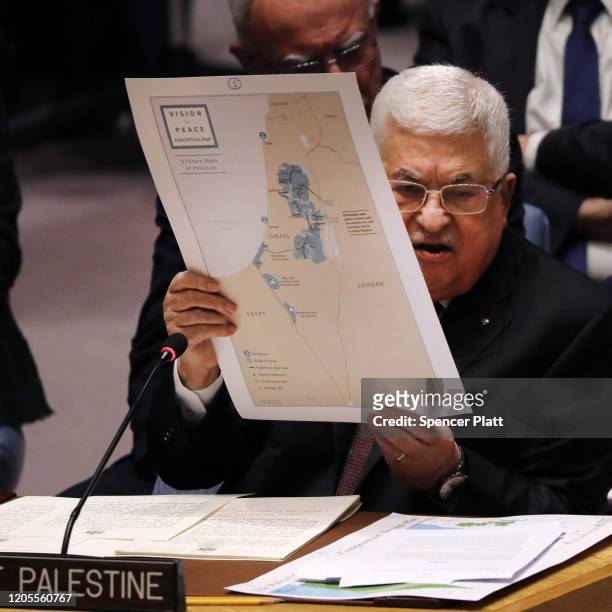 Palestinian President Mahmoud Abbas holds up a Vision for Peace map while speaking at the United Nations Security Council on February 11, 2020 in New...