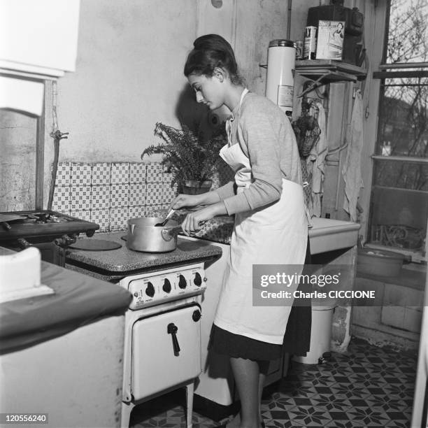 An Parisian Housewife In Her Kitchen In Paris, France In 1960.