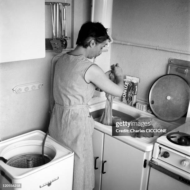 An Housewife Makes The Washing In Paris, France In 1961 - In her kitchen.