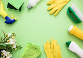 Cleaning products background, detergent bottles and tools