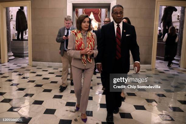 Speaker of the House Nancy Pelosi and Rep. Emanuel Cleaver walk back to Pelosi's office after settling their friendly wager on the Super Bowl in The...