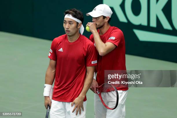 Ben McLachlan and Yasutaka Uchiyama of Japan play in their doubles match against Gonzalo Escobar and Diego Hidalgo of Ecuador on day two of the Davis...