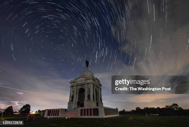 The Pennsylvania State Memorial is shown with a star trails sky above which is a composite of many photographs layered together at the Gettysburg...
